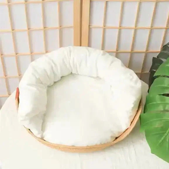 Cozy Bamboo Bed featuring a circular white cushion and wooden base for smart design