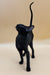 Black cat with upright tail and alert posture, perfect for an Oriental Kitten toy