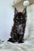 Fluffy black Maine Coon kitten with big eyes and ear tufts, super adorable Maine Coon