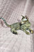 Grey tabby cat relaxing on quilted fabric for Quiqui Oriental Shorthair Kitten