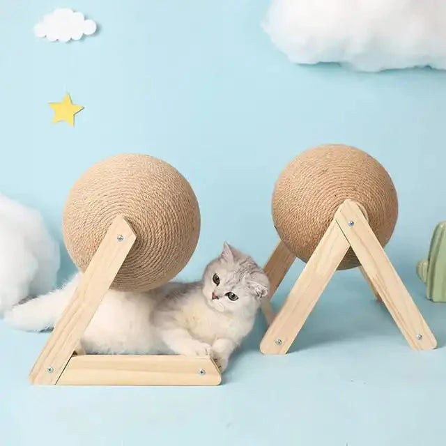 Fluffy white kitten chilling between wooden scratching balls that bring joy to cats