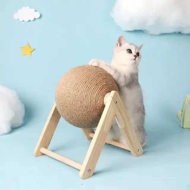White cat next to a wooden scratching ball on a wooden frame, ready to bring joy
