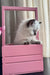 Fluffy Wynona the Scottish Straight Longhair kitten relaxing in a pink crate